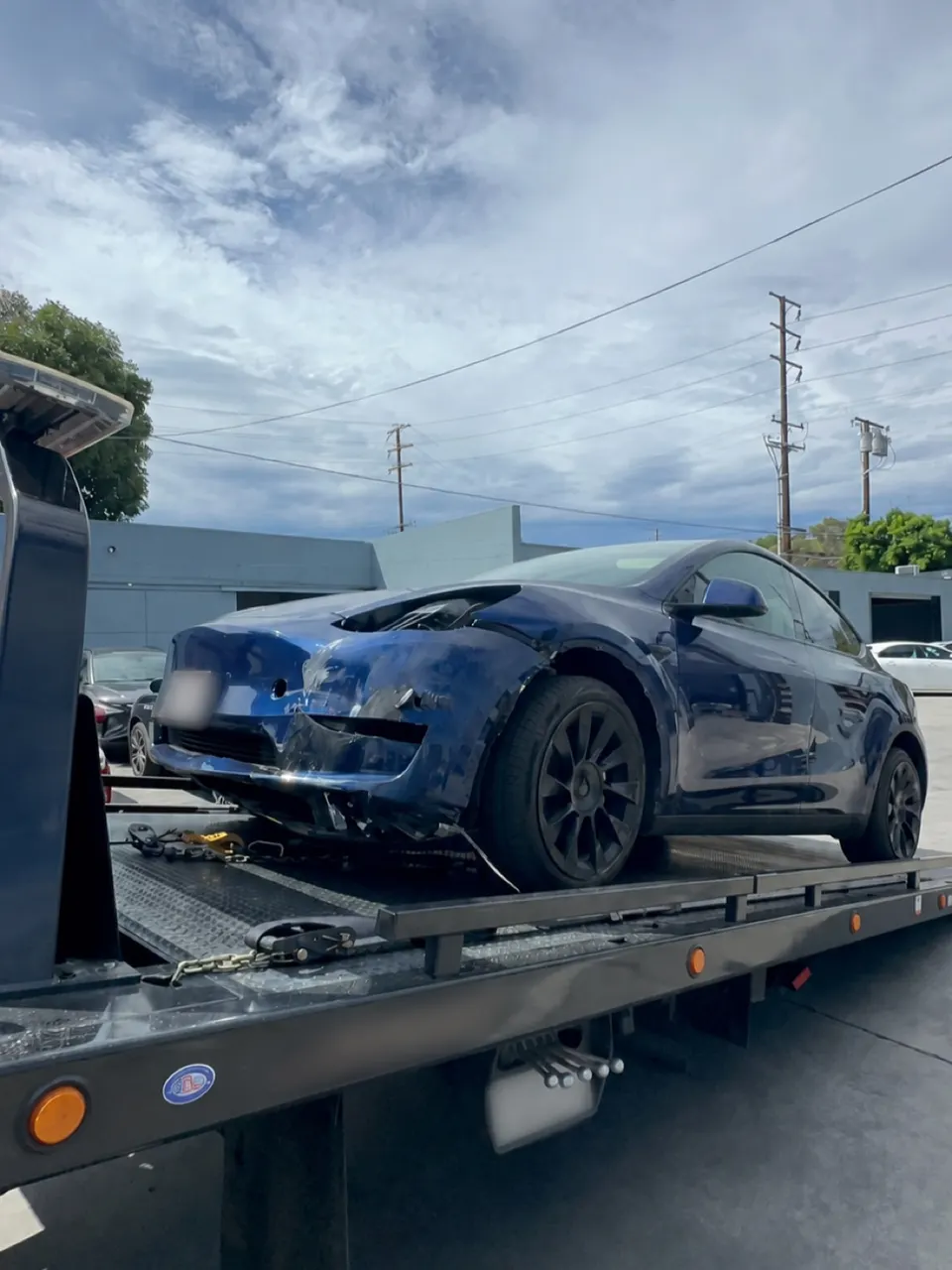 Tesla Model Y being prepared for transport